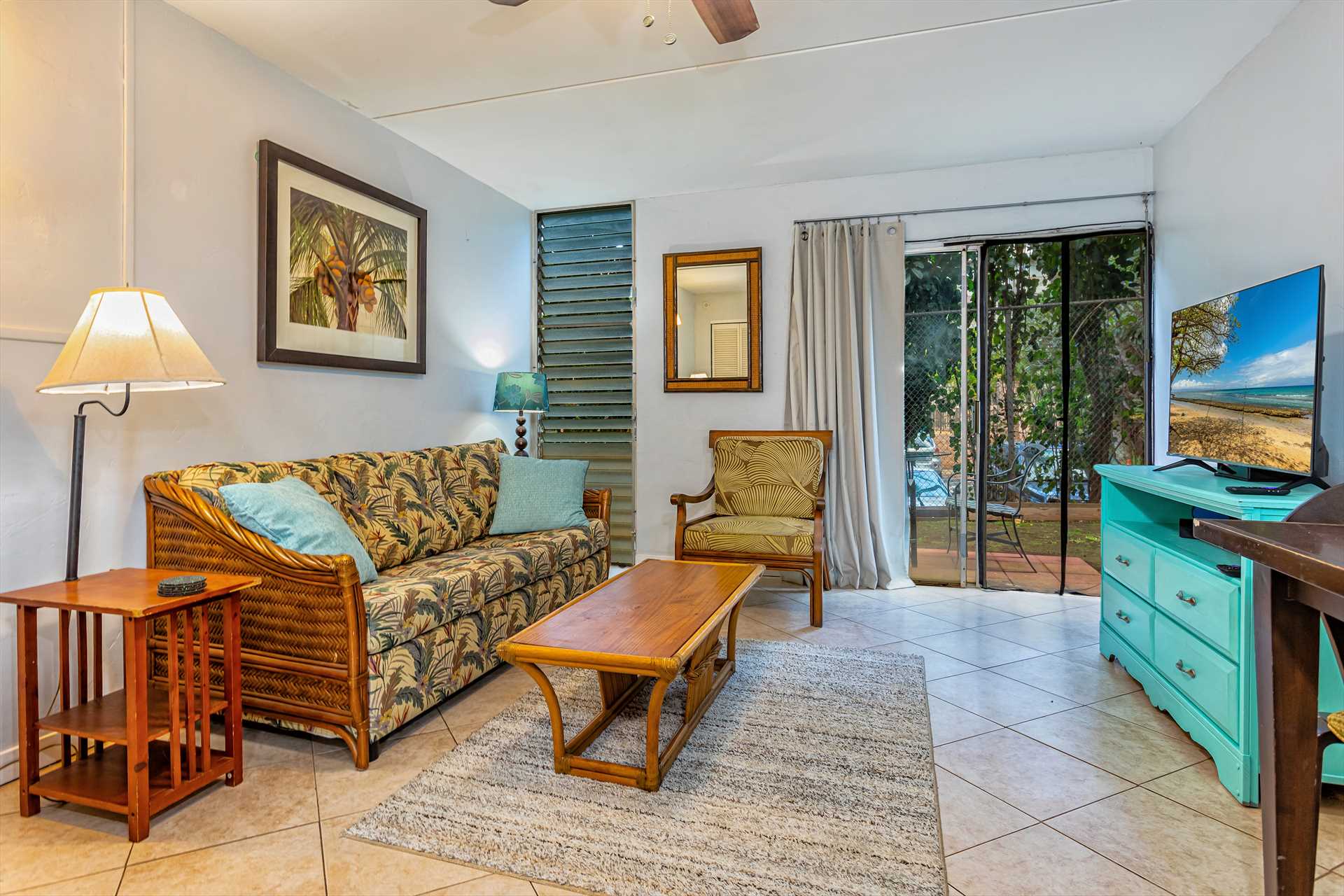 Fully furnished living area with lanai views